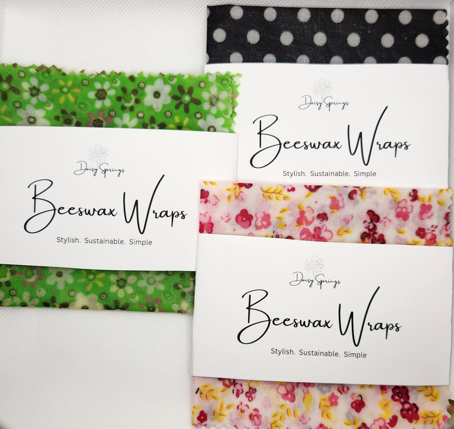 Individual medium beeswax wraps in black, green and pink